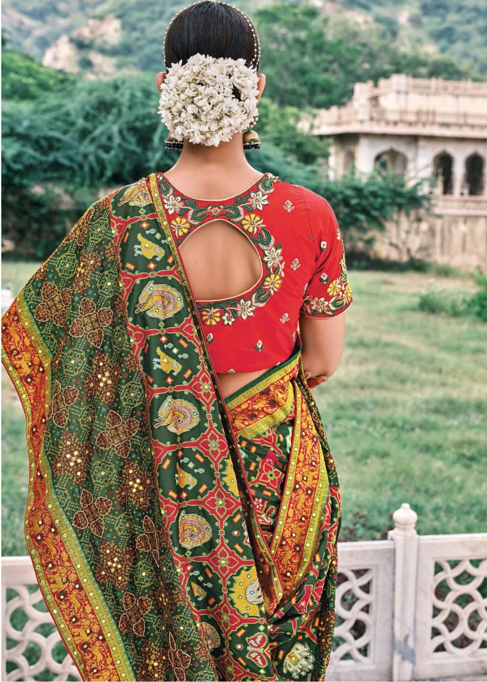 Pine Green Bandhej Patola Silk Saree with Embroidered Blouse