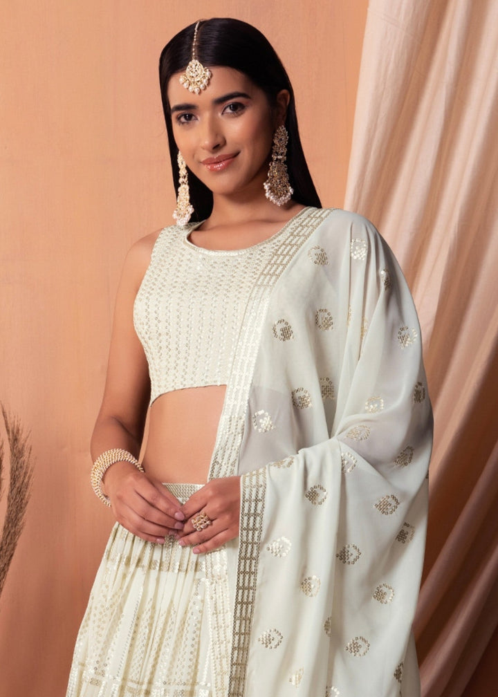 Off White Georgette Lehenga Choli With Sequins And Thread Embroidery Work