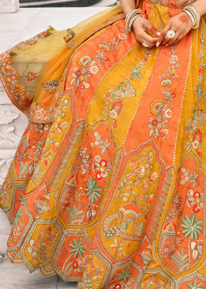 Pumpkin Orange & Yellow Fancy Silk Lehenga Choli With Cut Work Embroidery Border & Stone Work