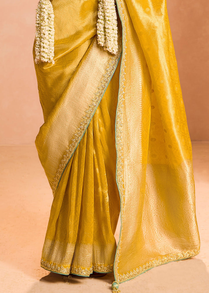 Butter Yellow Zari Tissue Silk Saree With Weaving Work And Heavy Embroidery Lace