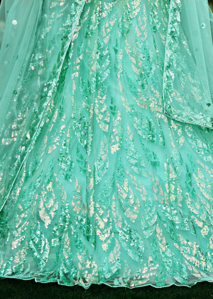 Aqua Blue Net Lehenga Choli With Multiple Sequins And Thread Embroidery Work